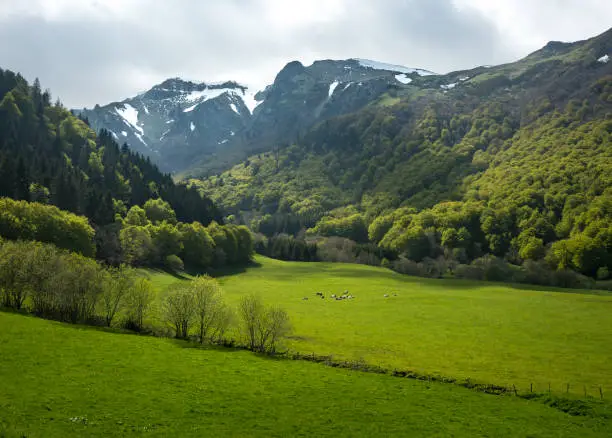 A sunlit valley and mountains in the Natural Reserve of the Valley Chaudefour, a national park in central France