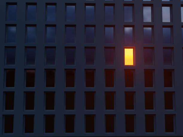 lonely luminous window in a dark house lonely luminous window in a dark house office window night stock pictures, royalty-free photos & images