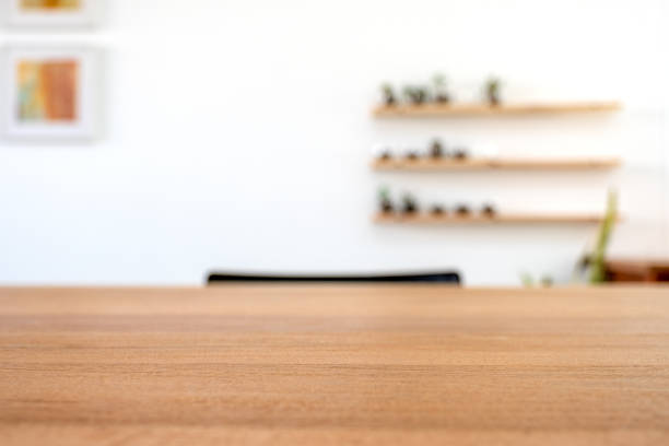 istock Wooden table with blurred white wall background 1072123416
