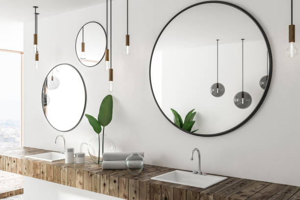 istock Wooden double bathroom sink and mirrors side view 1072126588