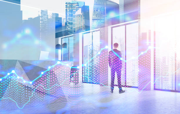 istock Businessman looking at city, cityscape and graphs 1072127082