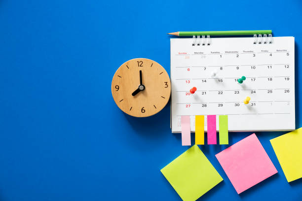 close up of calendar on the blue background, planning for business meeting or travel planning concept close up of calendar on the blue background, planning for business meeting or travel planning concept routine stock pictures, royalty-free photos & images
