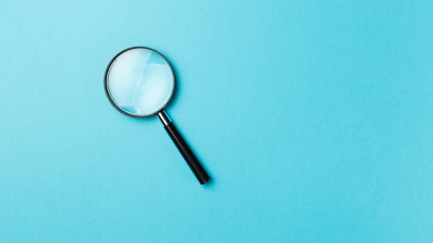 istock Magnifying glass on pastel background. Top view. Flat lay. Copy space. Minimal creative concept. Blue background in pastel colours 1072128576