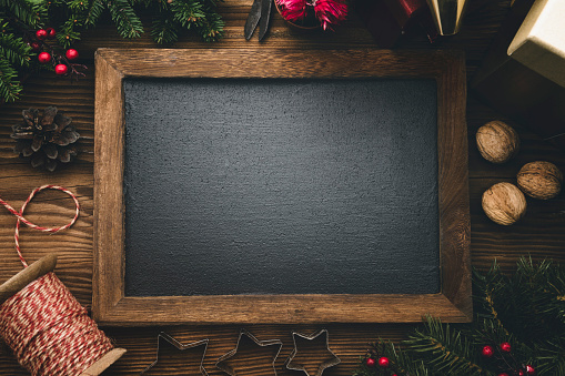 Christmas background with blackboard and decoration