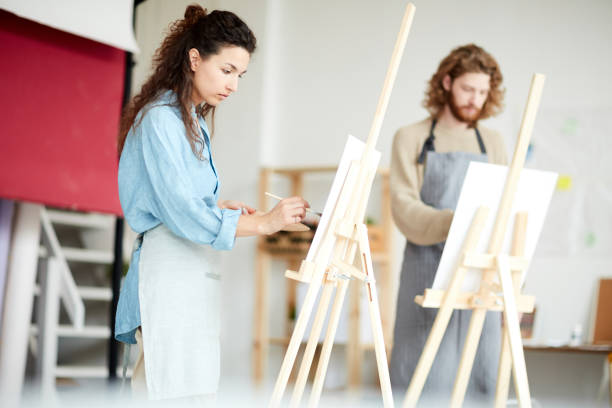 istock Colleagues painting 1072131142