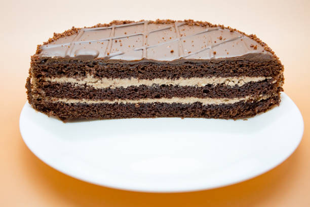 istock Cake in a cut on a white plate 1072131758
