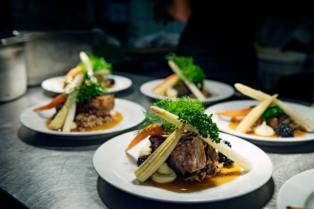 istock Plates at the pass ready to be served. 1072132364