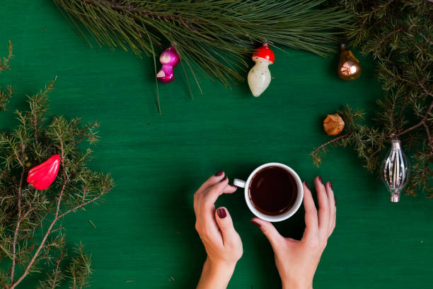 istock Christmas background hand new year coniferous branches presents winter postcard 1072132518