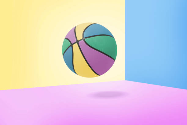 istock 3d rendering of single multi-colored basketball ball with black stripes hangs on a three-colored background. 1072135950