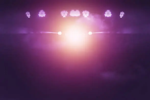 Photo of blurred lights on stage, abstract image of concert lighting