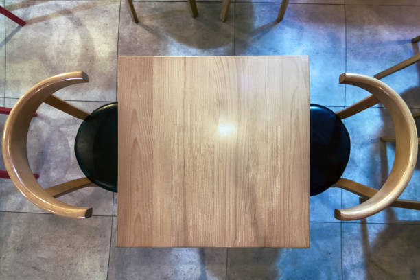 istock Top view empty wooden table and chairs in coffee shop 1072143764