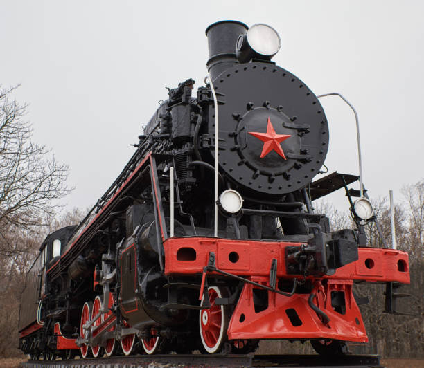 istock Old black and red soviet steam locomotive with red star in front 1072148972