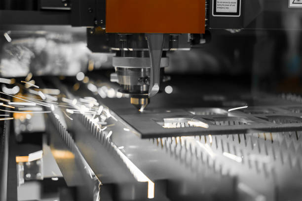 istock CNC laser cutting metal sheet with bright sparkle 1072152080