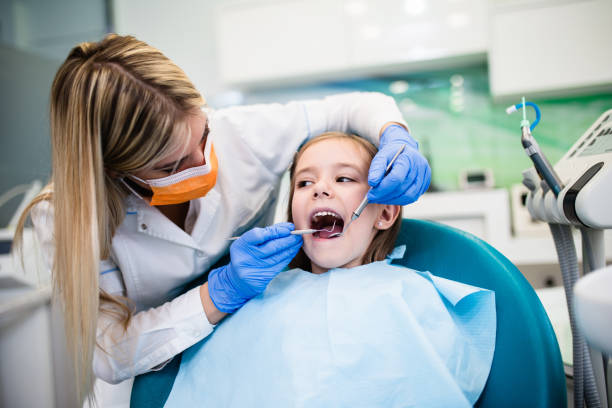 istock Girl at dentist office 1072152312