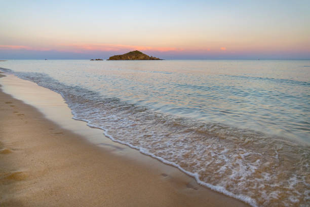 Su Giudeu island at sunset, Chia, Sardinia, Italy.
