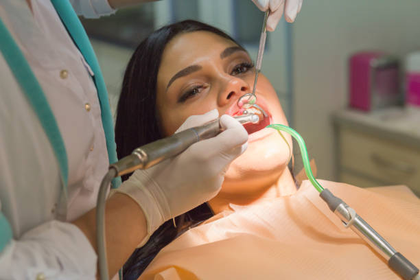 istock Female patient having a dental treatment 1072158716