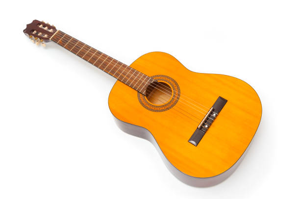 Close-up still life photo of a well-loved, long-owned, well-played 1970's vintage acoustic steel string guitar.