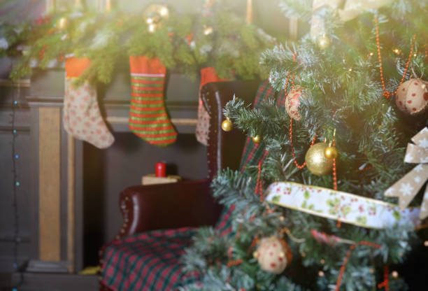 istock Christmas tree, fireplace and chair, light 1072166248