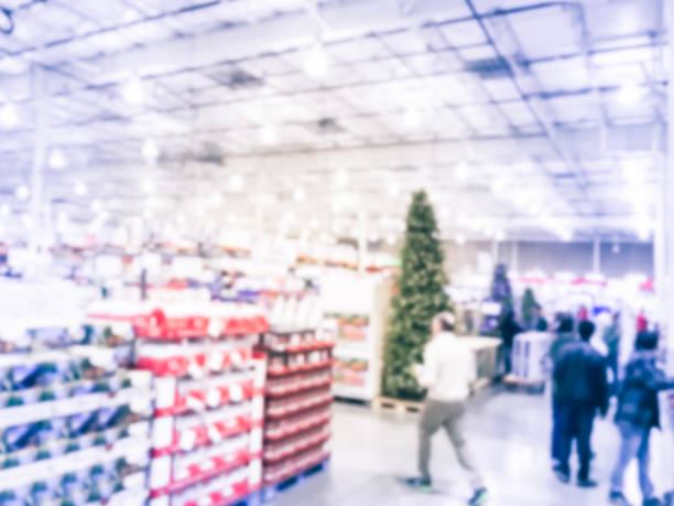 istock Blurry background customer shopping for Christmas tree in wholesale store 1072167164