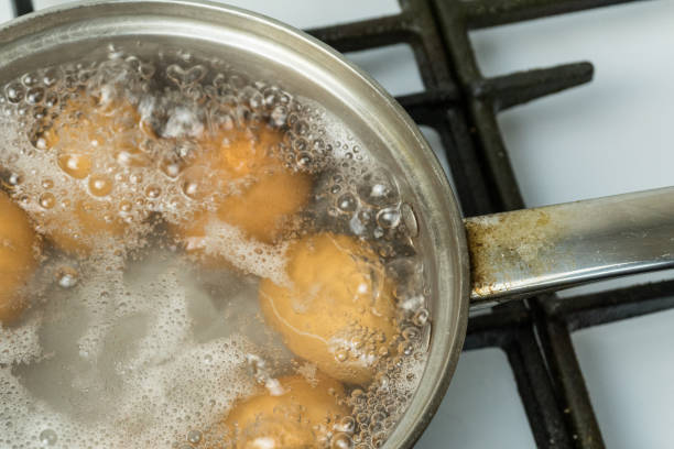istock Chicken eggs are boiled in water on a gas stove. 1072171844