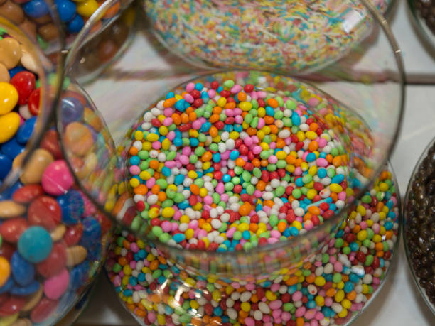 istock Colorful Confetti Candy inside Transparent Glass Container 1072173928