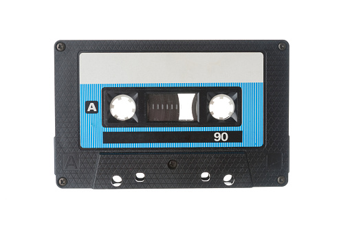 Audio tape cassette closeup on white background