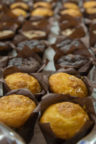 istock Several Types of Muffins Pastries arranged in Linear order on a Table 1072174210