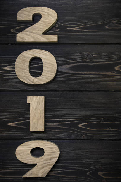istock New year 2019 on dark wooden background 1072177236