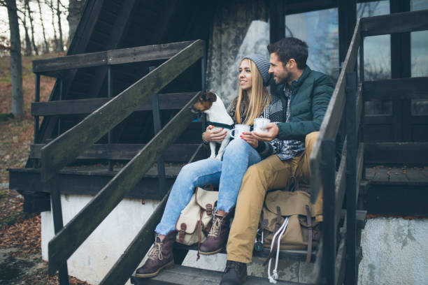 istock Cute Couple On Camping With Their Dog 1072177398