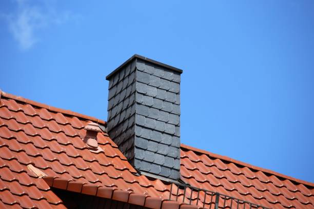 istock New tiled roof with chimney with slate cladding 1072177586