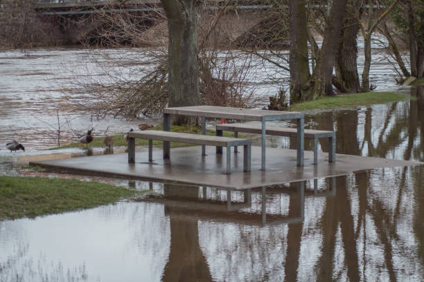 istock Park Bench Surrounded By Flood Water In Cham, Bavaria, Germany 1072179136