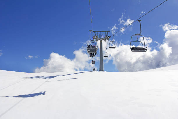 istock Mountain slopes with Ski lift on a winter sunny day 1072185898