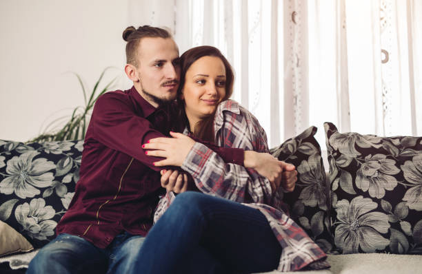 istock Young couple hugging in their home 1072186404