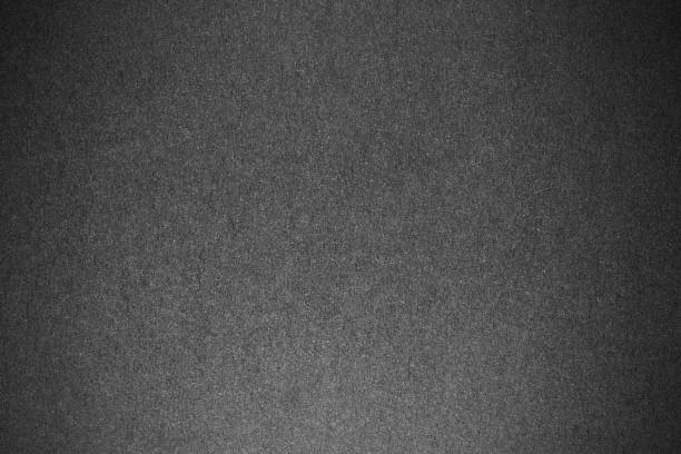 istock Textured black blank cardboard paper background. copy space 1072191762