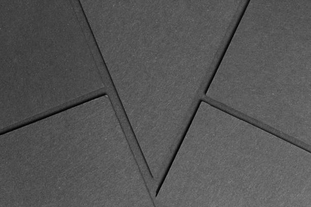 istock black textured blank cardboard on geometric graphic background. copy space 1072191820
