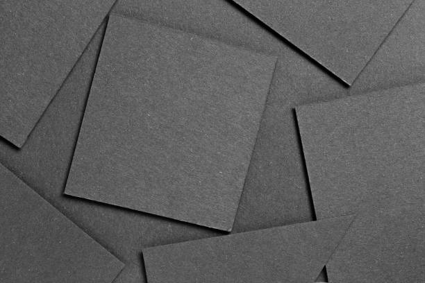 istock black textured blank cardboard on geometric graphic background. copy space 1072191920