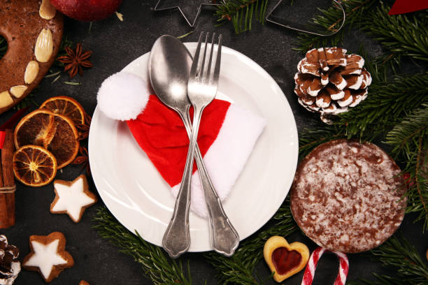 istock Festive table setting for xmas with fork, knife, nuts and apples a christmas dish concept 1072194502