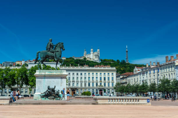 Bellecour square in Lyon Lyon, France - July 18, 2018: The Bellecour square in Lyon with Statue of Louis XIV and basilica of our lady of Fourviere. This is the central square of the city of Lyon. fourviere stock pictures, royalty-free photos & images