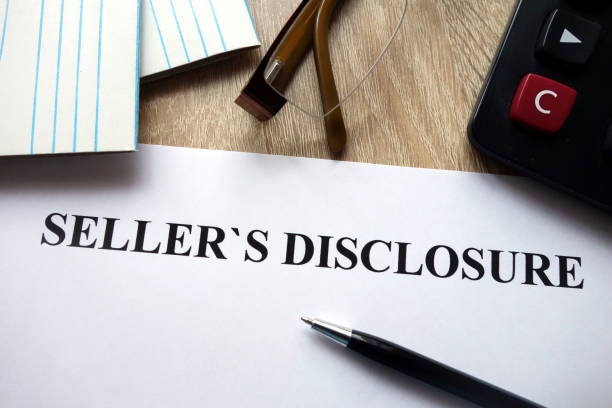 istock Seller`s disclosure statement with pen, calculator and glasses 1072194710