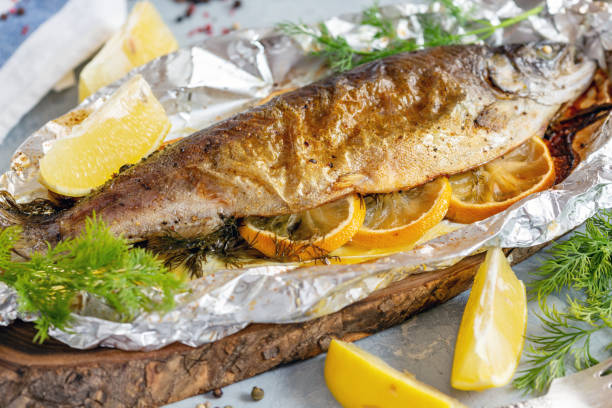istock Baked lake trout with lemon slices. 1072198166