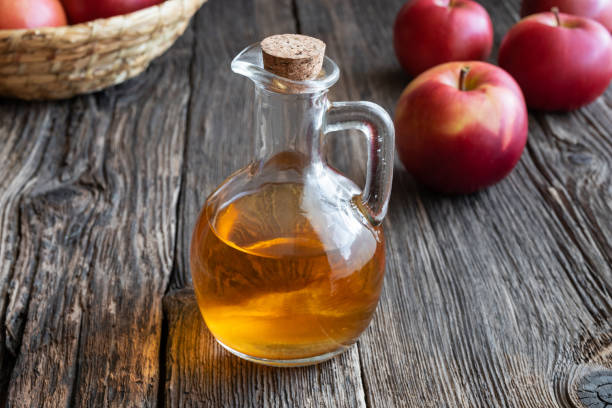 istock A bottle of apple cider vinegar with fresh apples 1072199806