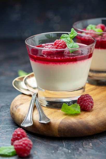 istock Vanilla Panna cotta with berry sauce and raspberry. 1072199856