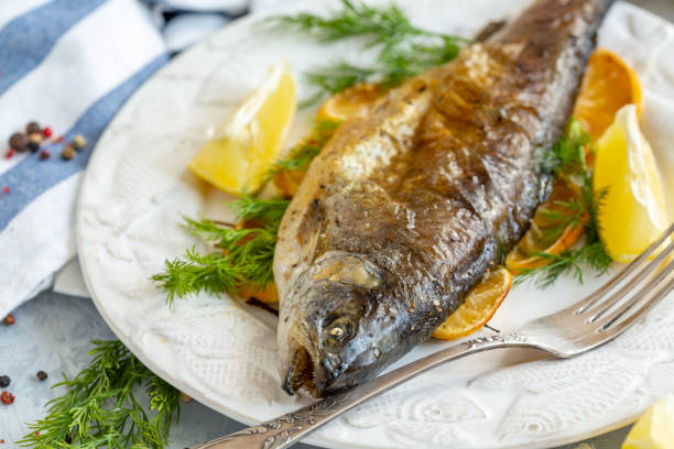 istock Baked lake trout with lemon and dill. 1072199898