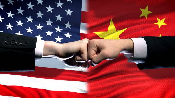 istock US vs China conflict, international relations crisis, fists on flag background 1072201364