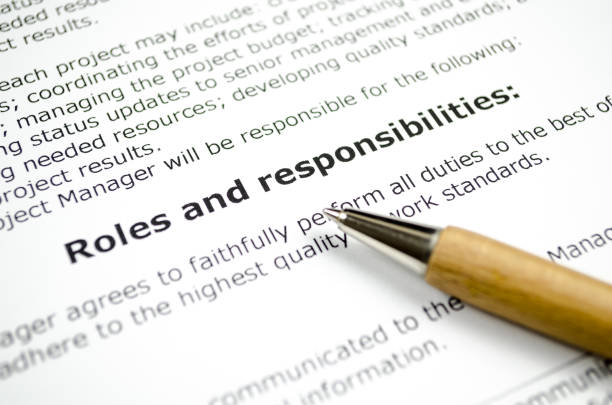 istock Roles and responsibilities with wooden pen 1072201488