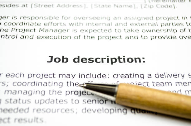 job description with wooden pen - managment imagens e fotografias de stock