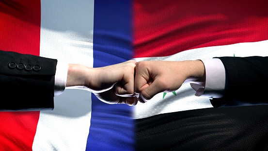 France vs Syria conflict, international relations, fists on flag background