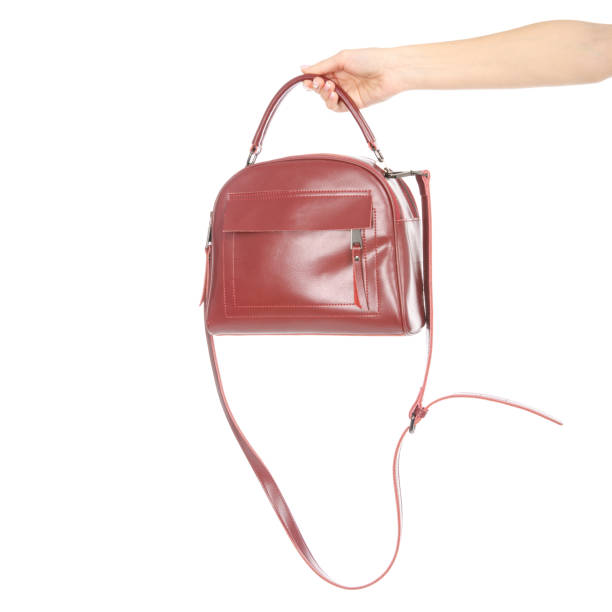 istock Woman's female red leather bag in hand 1072203876