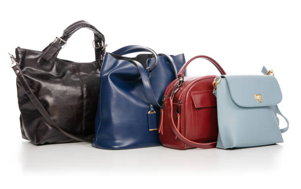 istock Woman's female bags pile many different 1072203916