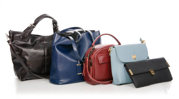 istock Woman's female bags pile many different 1072203928